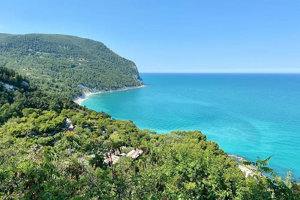 Italy Moto Tours Turquoise Adriatic sea and cliffs of the Conero Riviera near Sirolo and Numana, Marche, Italy