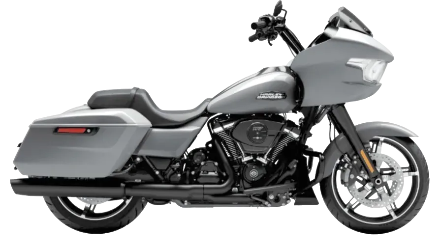 Side profile of a silver Harley-Davidson Road Glide touring bike with fixed shark-nose fairing and hard saddlebags.