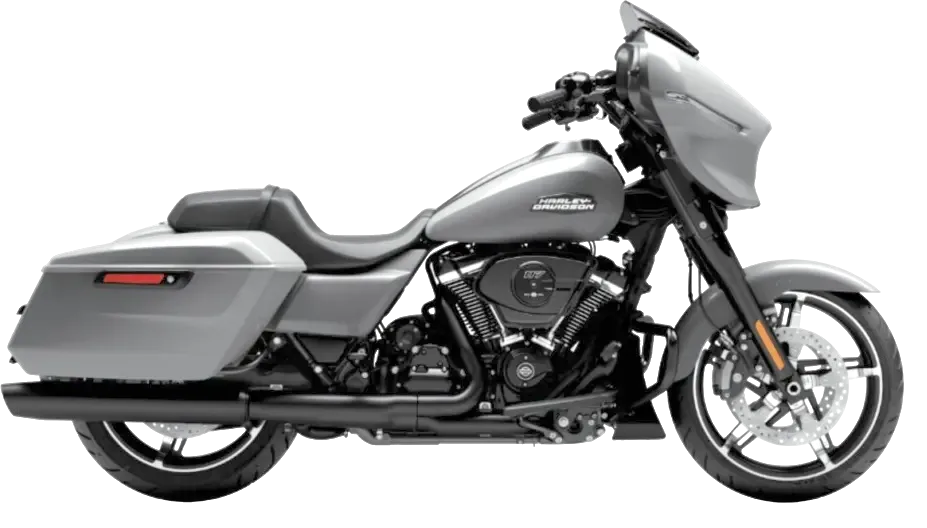 Silver Harley-Davidson Street Glide in side view with batwing fairing and hard saddlebags.