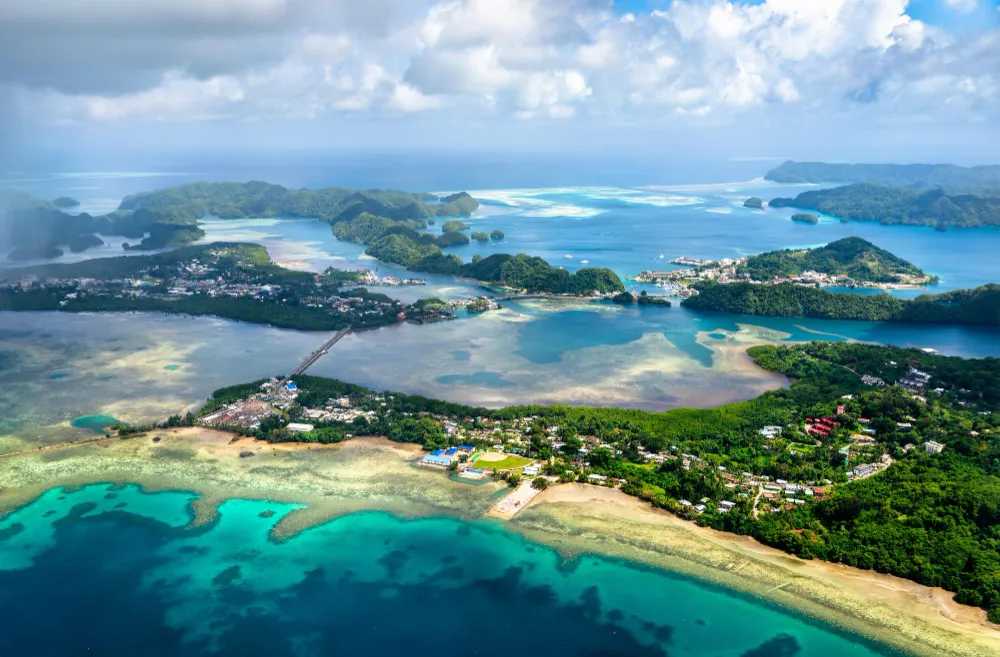 Italy Moto Tours Coastal view near Palau, Sardinia, with clear blue water and islets of the Maddalena Archipelago