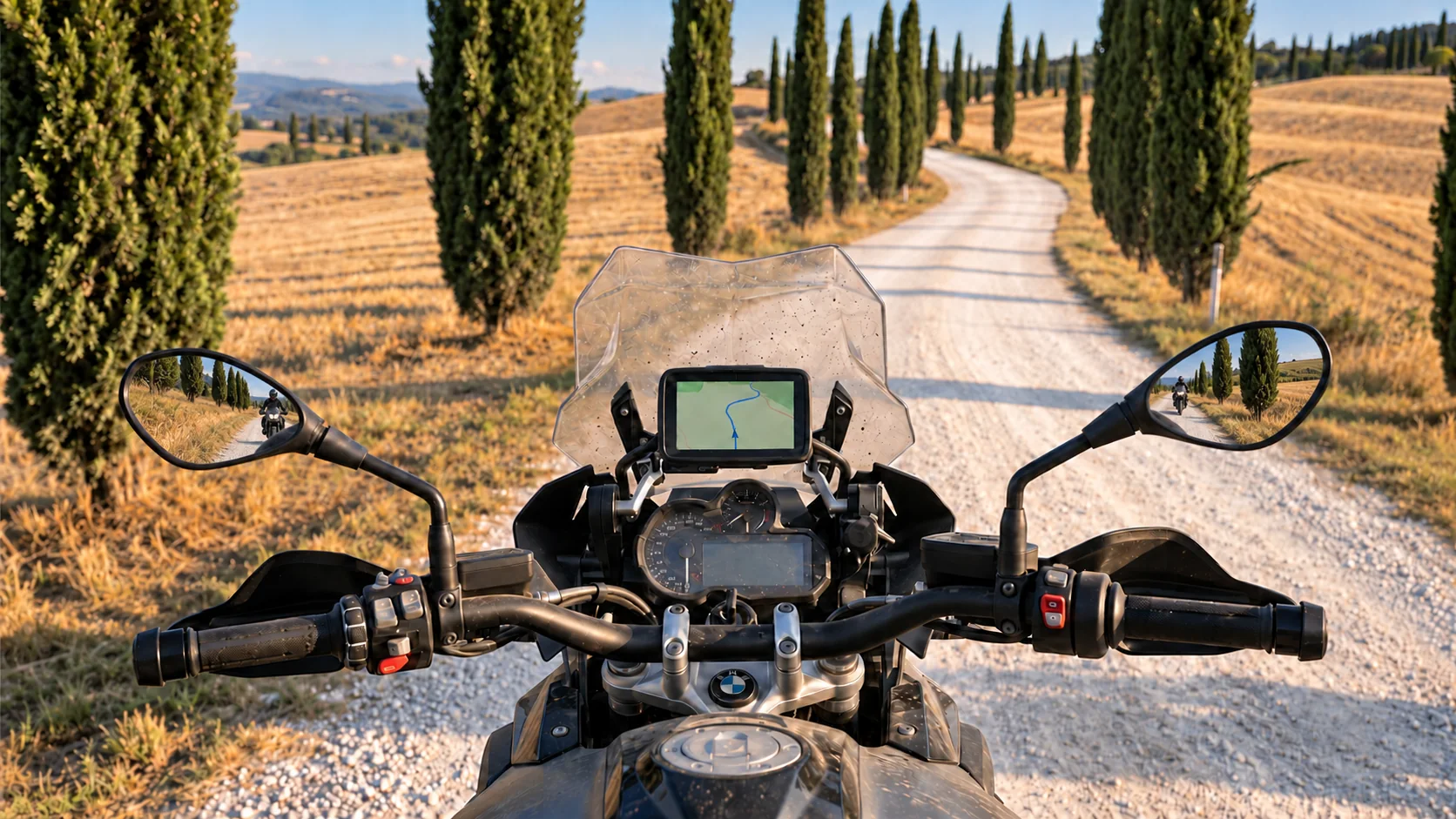 Motorcycle cockpit facing a gravel lane lined with cypress trees, with following riders reflected in the mirrors