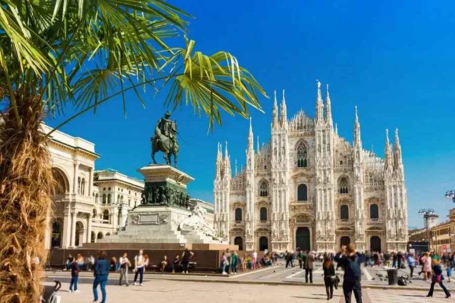The iconic Milan Cathedral (Duomo di Milano) with equestrian statue in Piazza del Duomo, a must-see stop before touring the Dolomites.