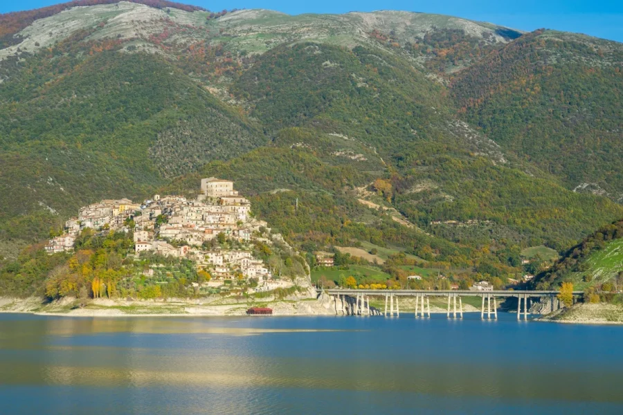 Castel di Tora and its bridge beside Lake Turano in Lazio, Italy.